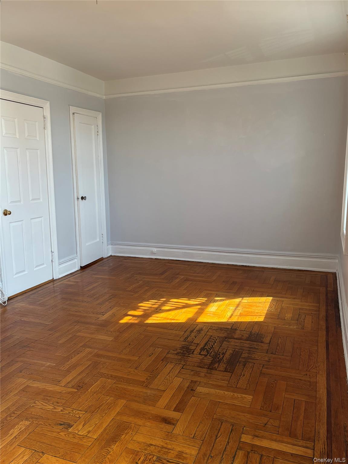 5005 43rd Avenue, Unit 5H Queens, NY 11377 - Photo 22 of 23 Empty room featuring baseboards