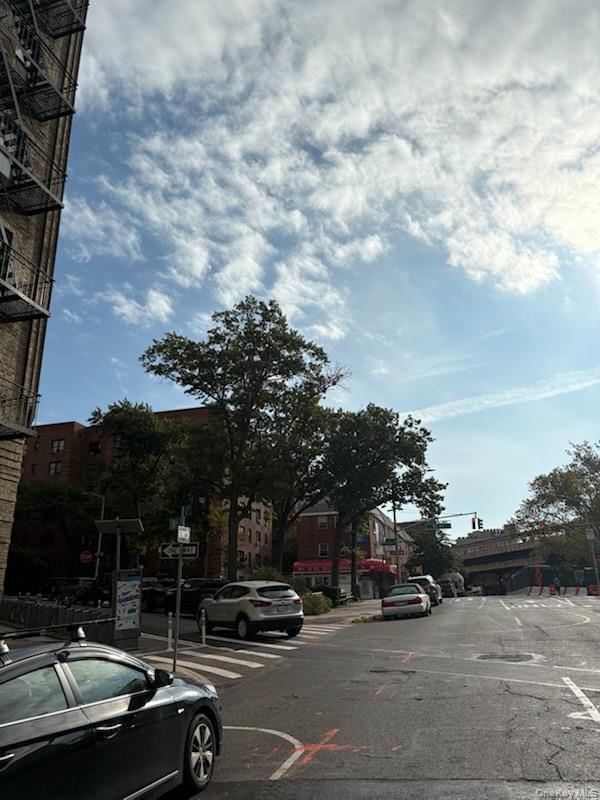 5005 43rd Avenue, Unit 5H Queens, NY 11377 - Photo 7 of 23 View of asphalt road with sidewalks and curbs