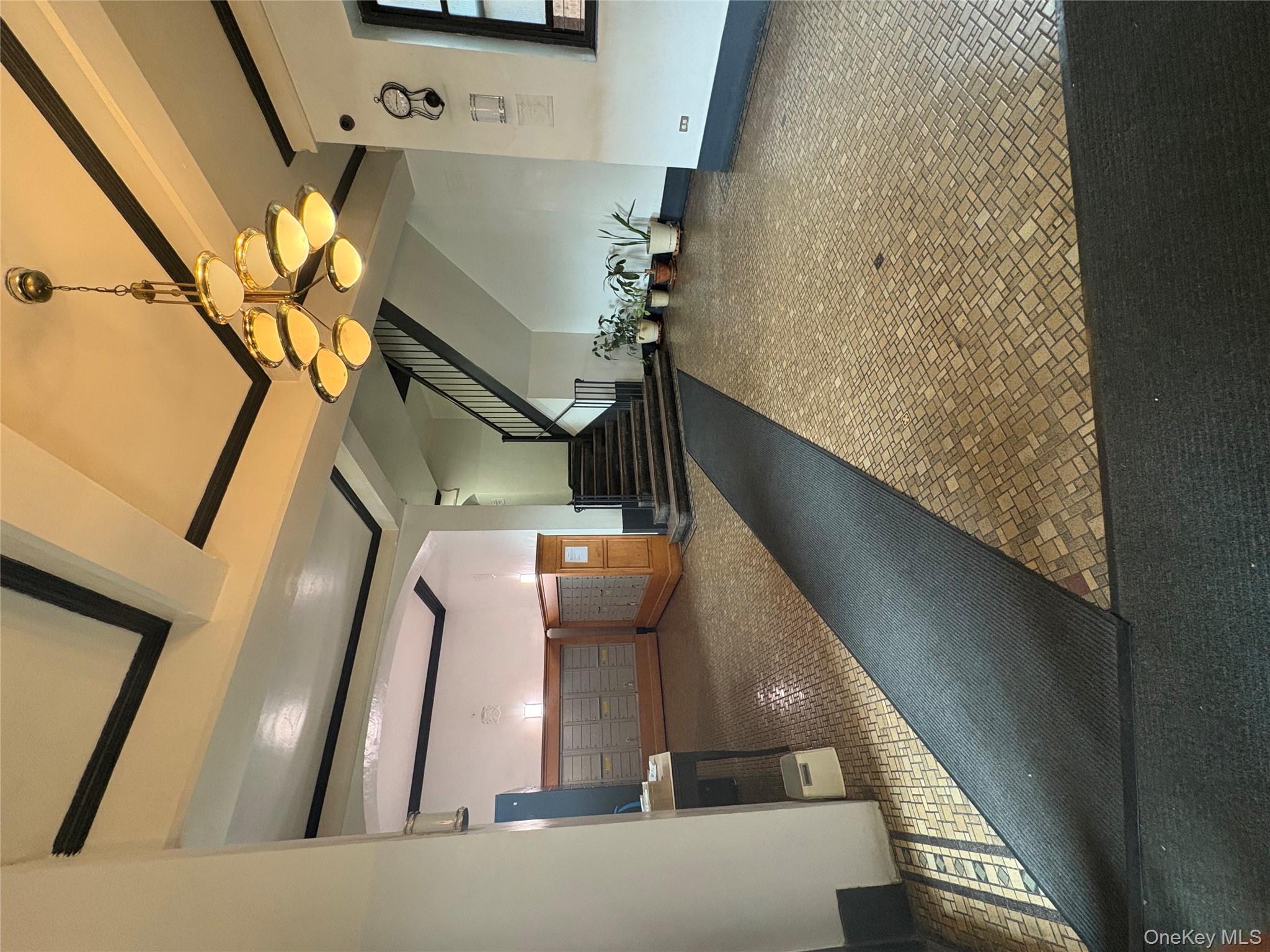 5005 43rd Avenue, Unit 5H Queens, NY 11377 - Photo 8 of 23 Common area featuring beam ceiling