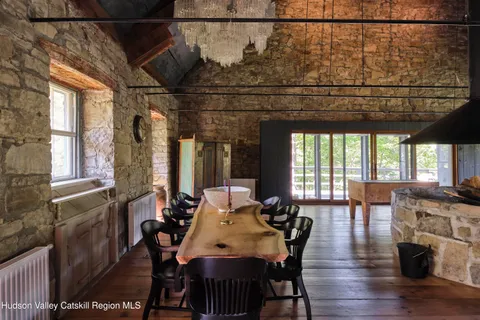 a view of a dining room with furniture window and outside view
