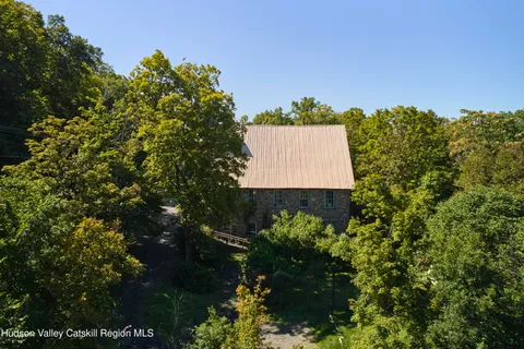an aerial view of a house with a yard