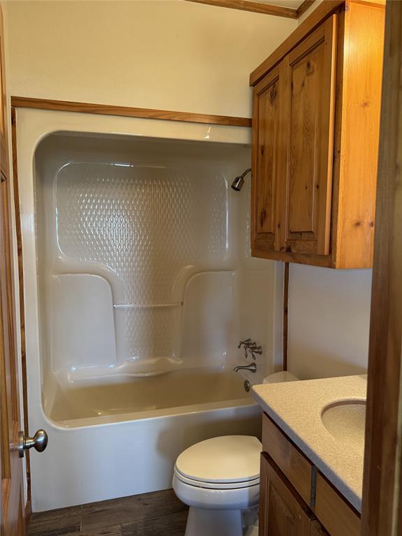 655 Loftice Road Gunter, TX 75058 - Photo 12 of 29 a bathroom with a granite countertop sink mirror vanity and toilet