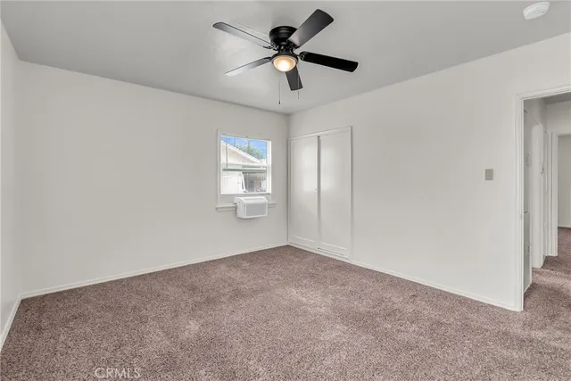 a bathroom with a shower sink and mirror