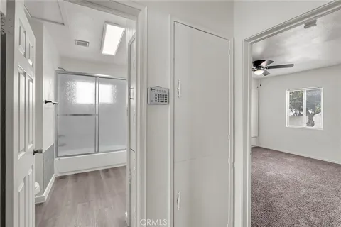 a bathroom with a toilet and a shower curtain