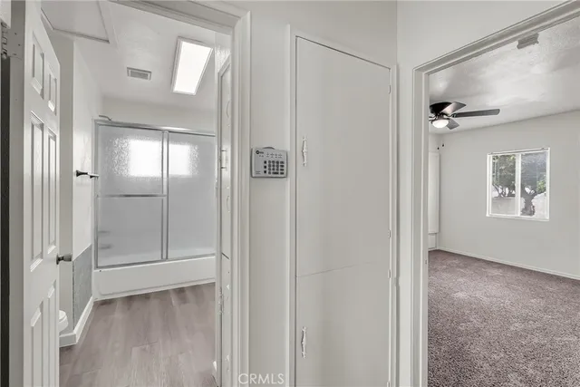 a bathroom with a toilet and a shower curtain