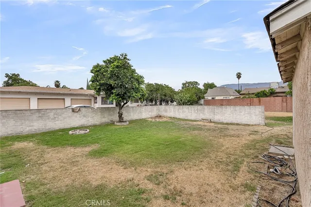 a backyard of a house with lots of green space