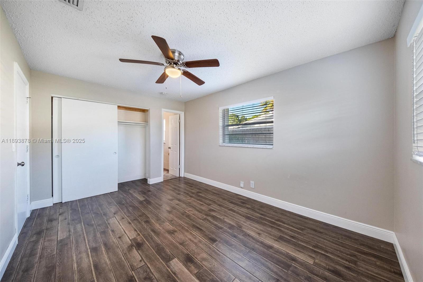 3589 Island Road Palm Beach Gardens, FL 33410 - Photo 14 of 40 a view of empty room with wooden floor