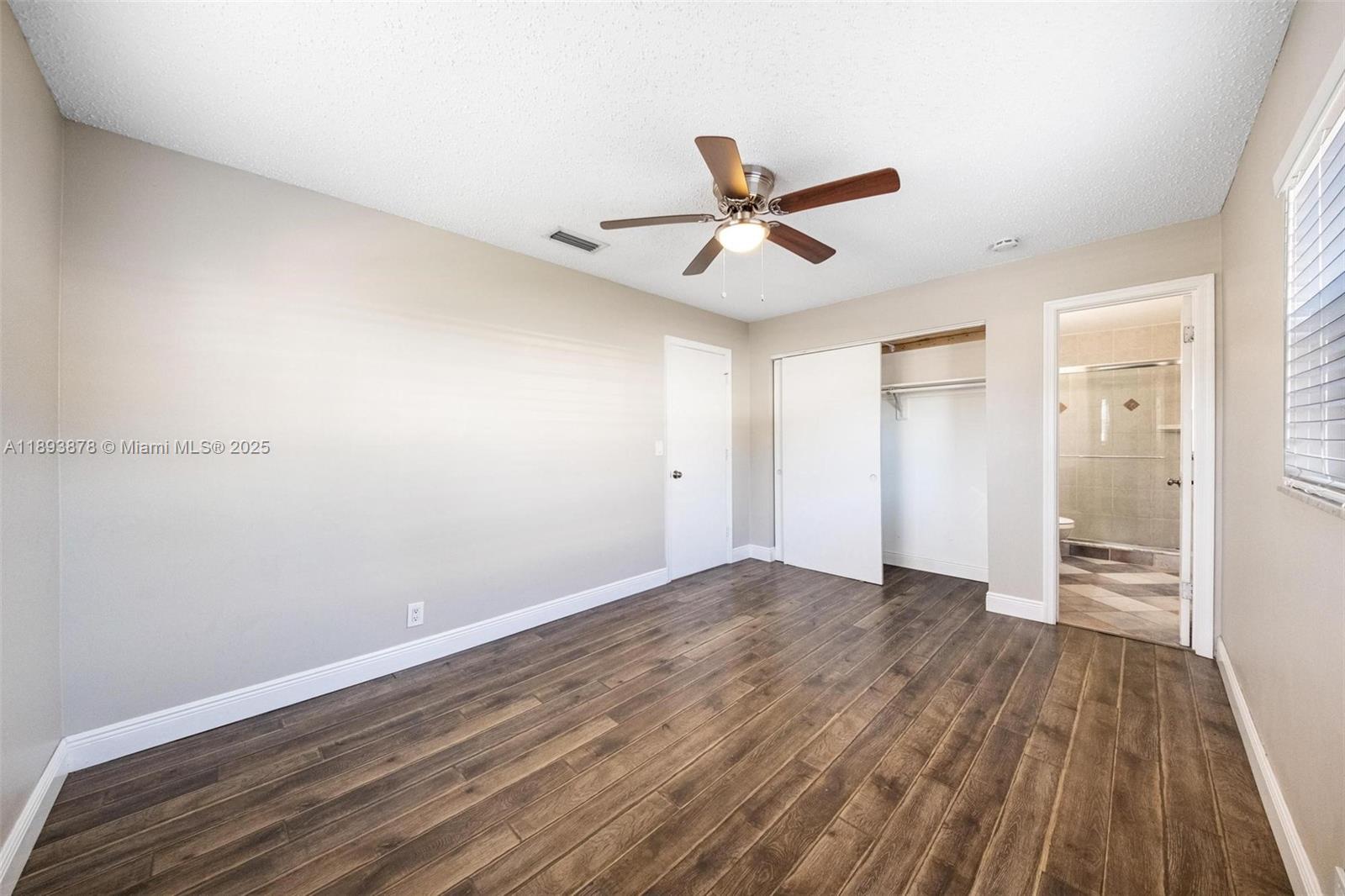 3589 Island Road Palm Beach Gardens, FL 33410 - Photo 16 of 40 a view of empty room with wooden floor
