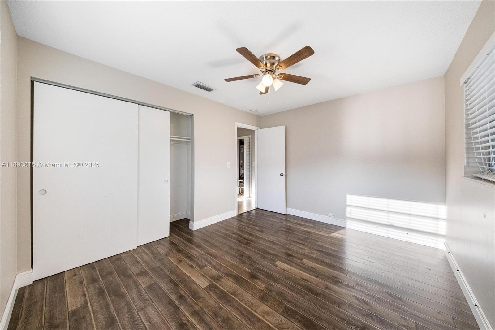 3589 Island Road Palm Beach Gardens, FL 33410 - Photo 17 of 40 a view of empty room with wooden floor