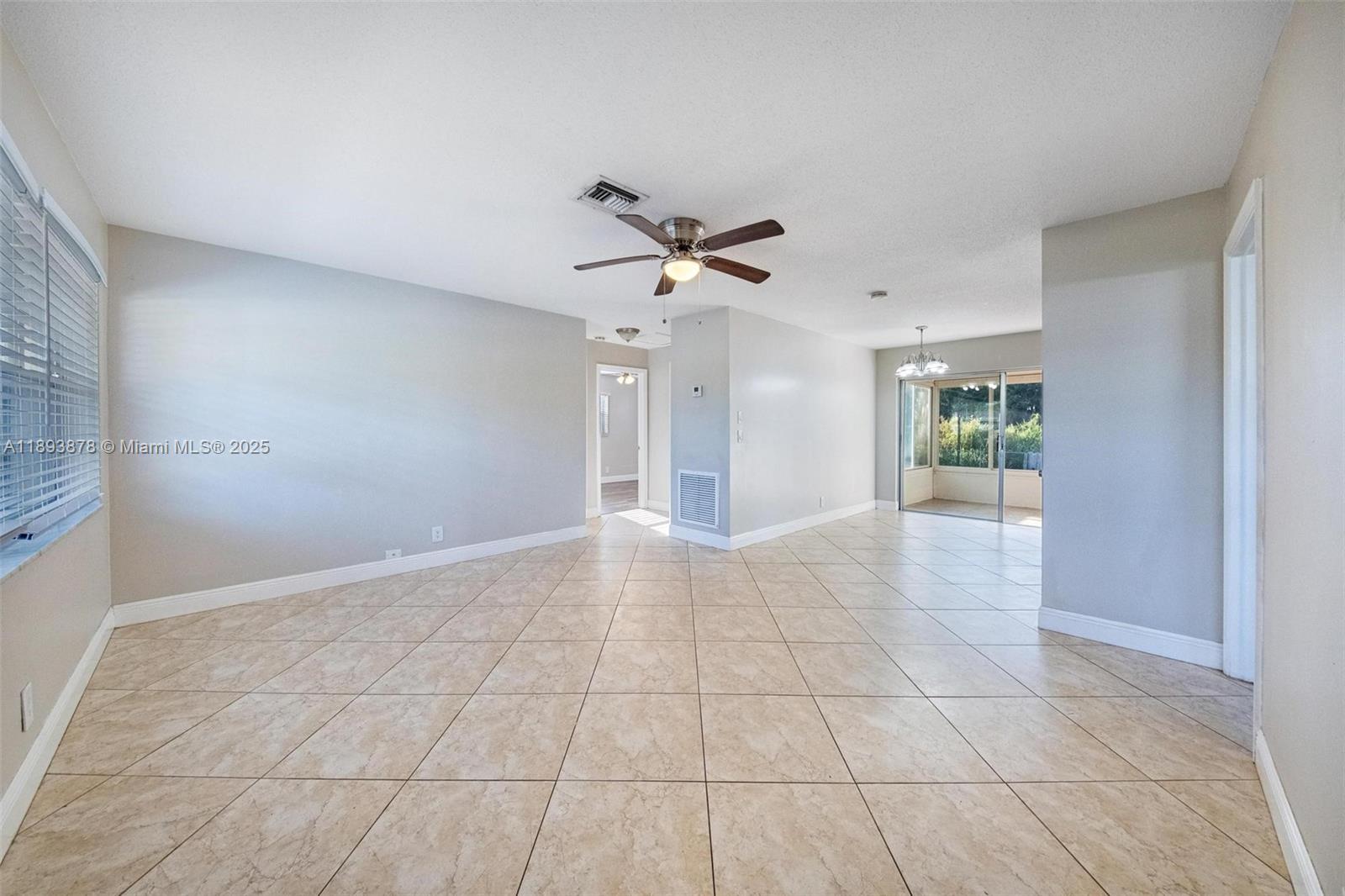 3589 Island Road Palm Beach Gardens, FL 33410 - Photo 18 of 40 a view of an empty room with a ceiling fan