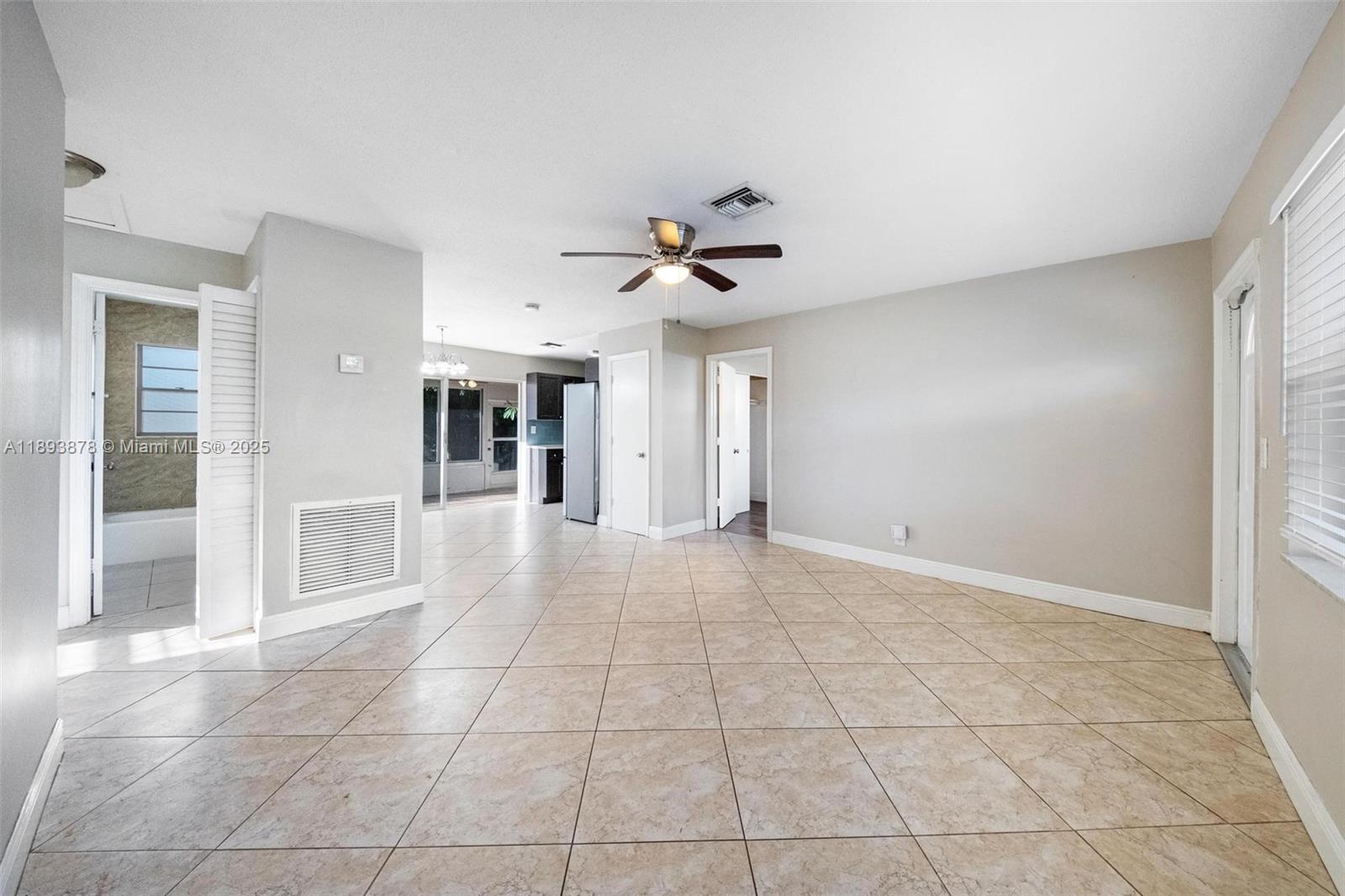 3589 Island Road Palm Beach Gardens, FL 33410 - Photo 19 of 40 a view of an empty room with a ceiling fan