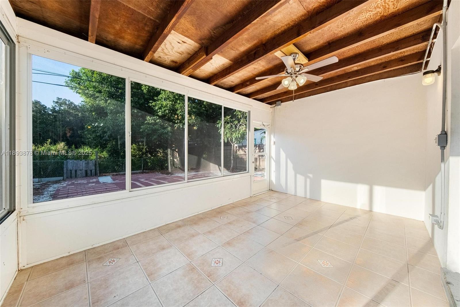 3589 Island Road Palm Beach Gardens, FL 33410 - Photo 26 of 40 a view of an empty room with a balcony