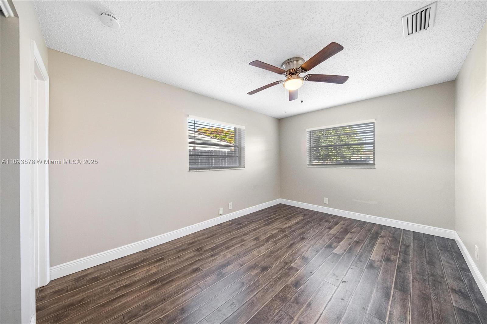 3589 Island Road Palm Beach Gardens, FL 33410 - Photo 27 of 40 a view of empty room with wooden floor