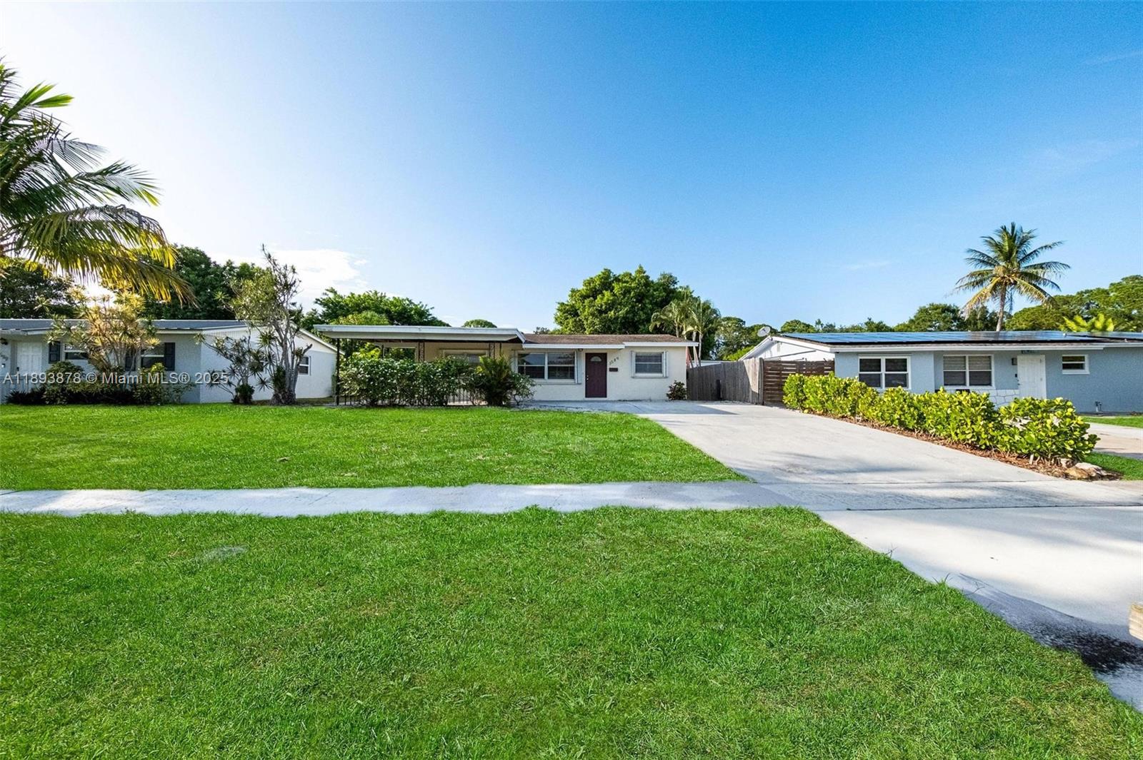 3589 Island Road Palm Beach Gardens, FL 33410 - Photo 3 of 40 a view of house with a swimming pool