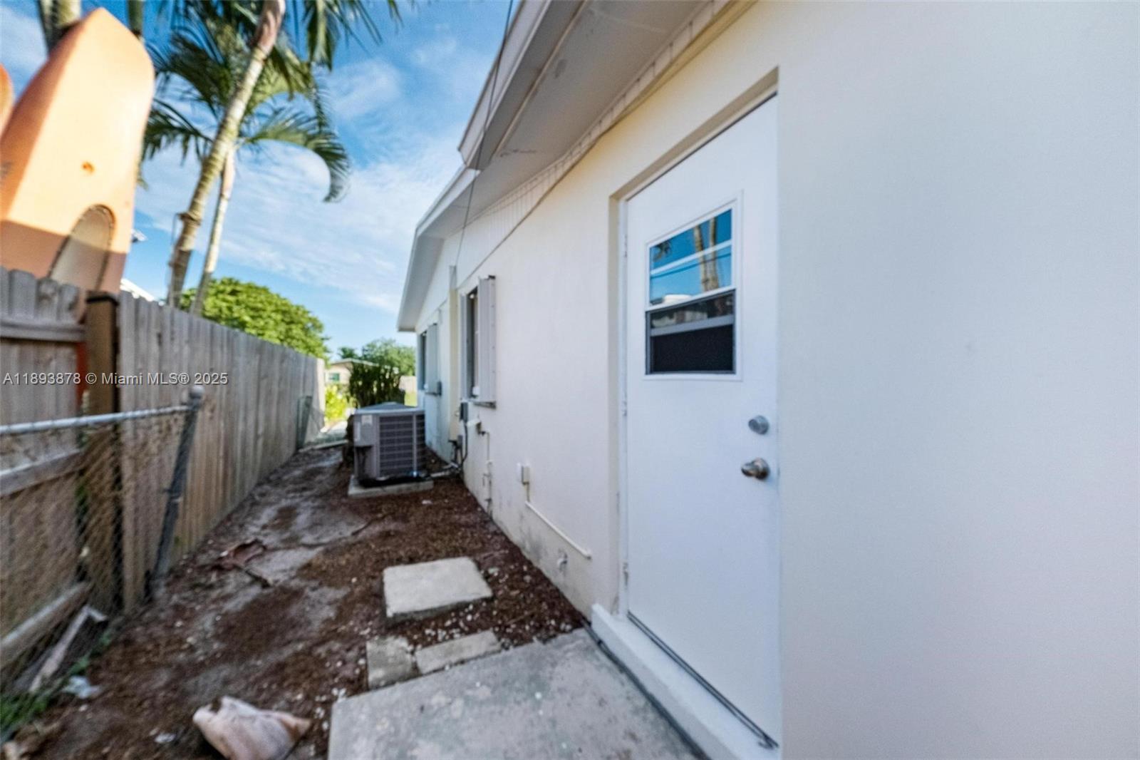 3589 Island Road Palm Beach Gardens, FL 33410 - Photo 35 of 40 a view of a house with a backyard