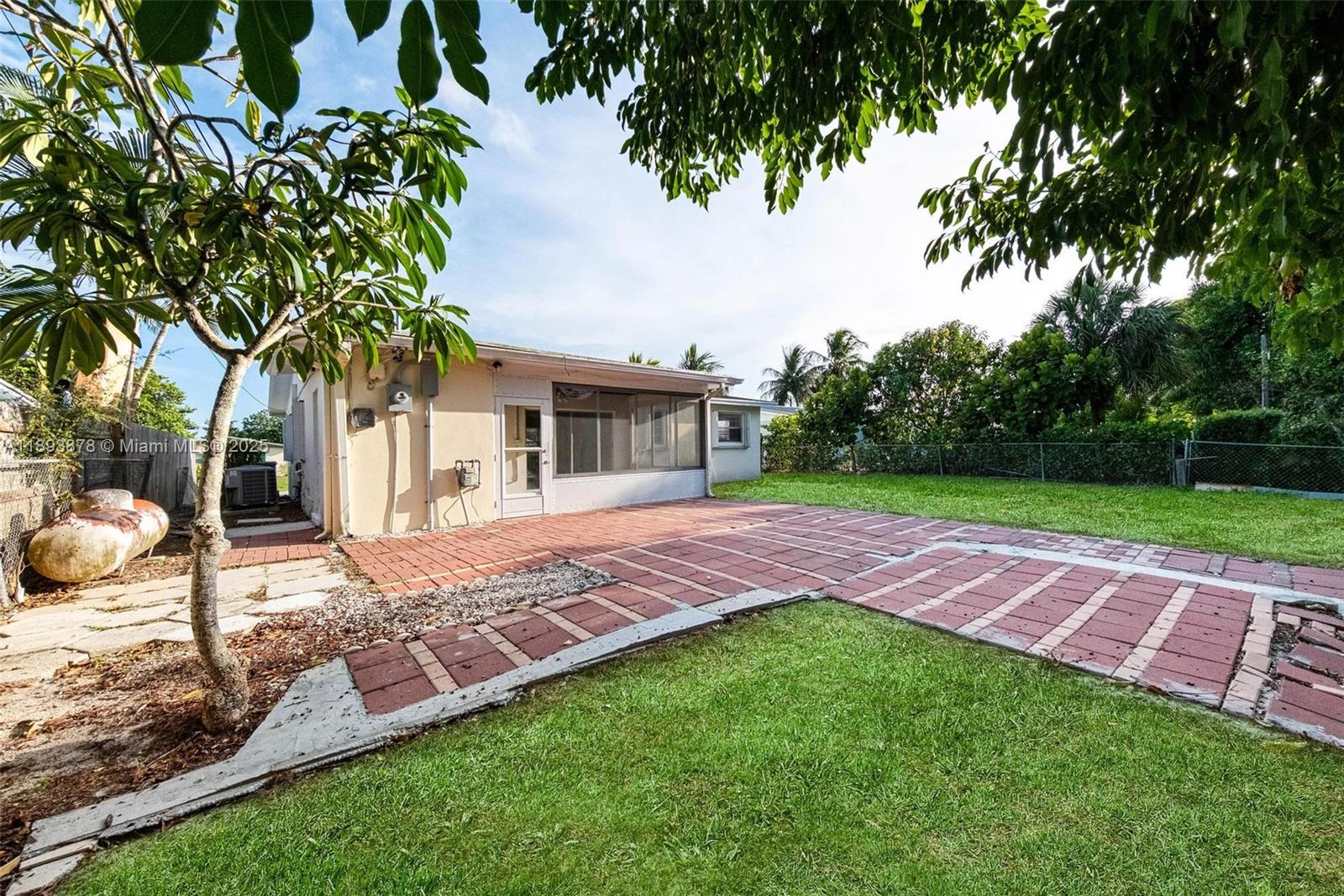 3589 Island Road Palm Beach Gardens, FL 33410 - Photo 38 of 40 a view of house with backyard and trees