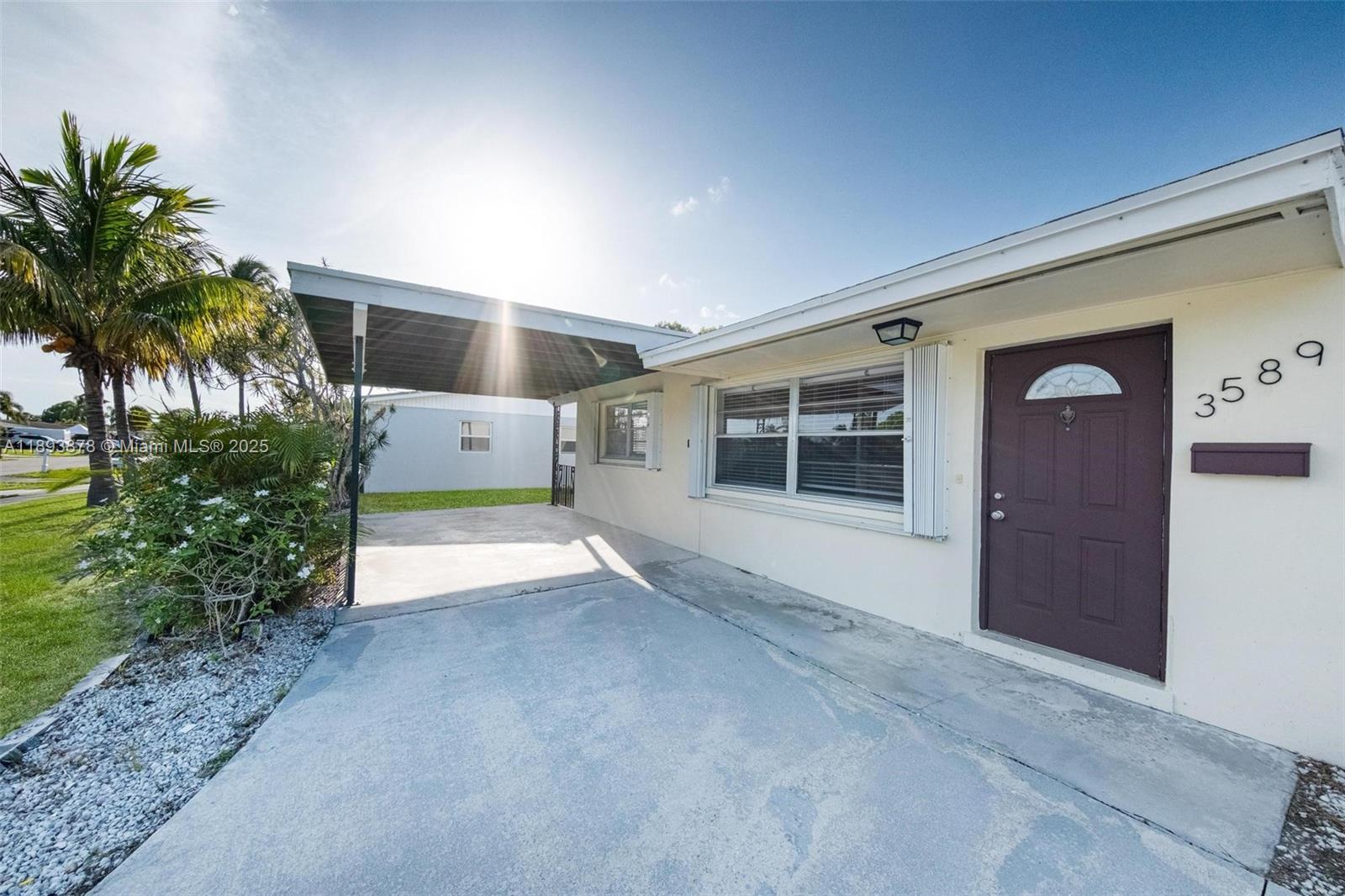 3589 Island Road Palm Beach Gardens, FL 33410 - Photo 5 of 40 a view of house with outdoor space and porch