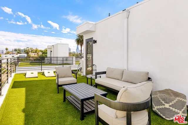 a view of a balcony with chairs