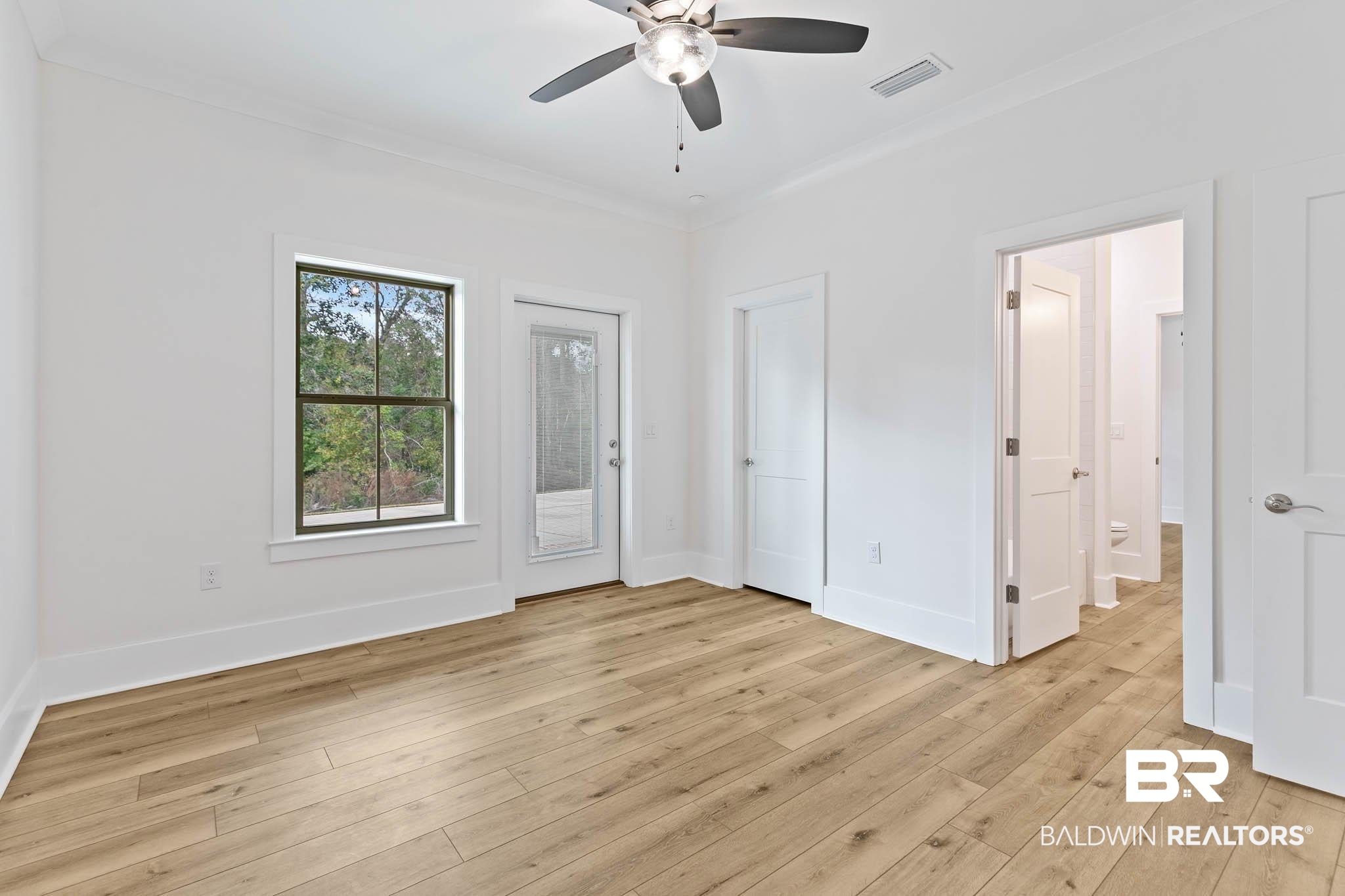 6656 Garrison Drive Daphne, AL 36527 - Photo 38 of 57 Unfurnished bedroom with access to outside, light wood finished floors, a ceiling fan, and ornamental molding