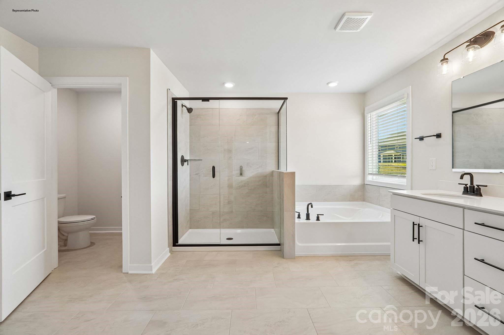 541 Mahogany Road York, SC 29745 - Photo 30 of 32 a bathroom with a tub sink and mirror
