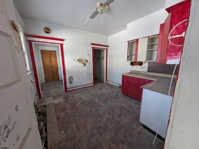 a hallway with windows and brick walls