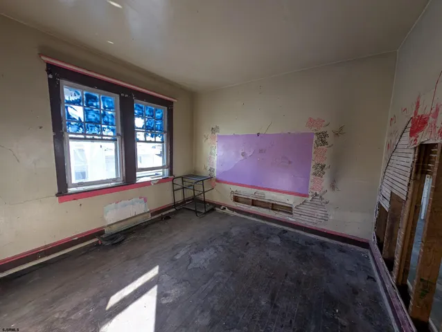 a view of empty room with windows