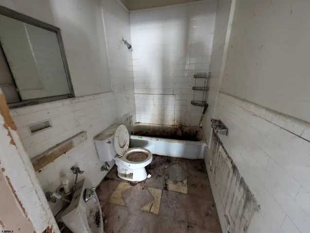 a bathroom with a toilet and a sink