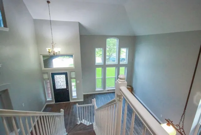 a view of a hallway with windows