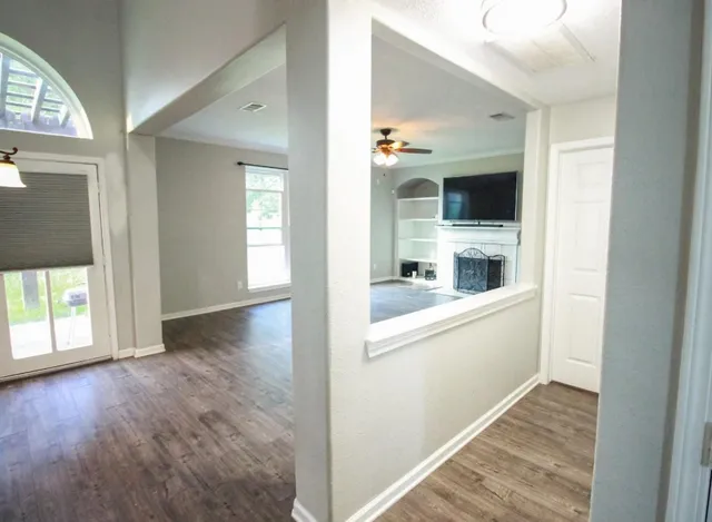 a view of a kitchen from the hallway