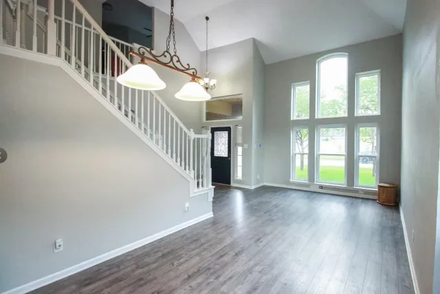 a view of an entryway with wooden floor