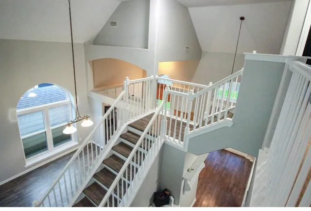 a view of entryway livingroom and hall with wooden floor