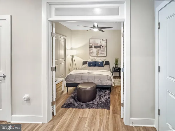 a bedroom with a bed and a couch