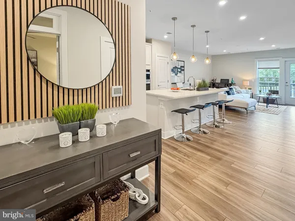 a kitchen with stainless steel appliances kitchen island granite countertop a stove a sink and a refrigerator