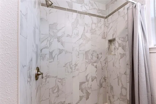 a bathroom with a shower curtain