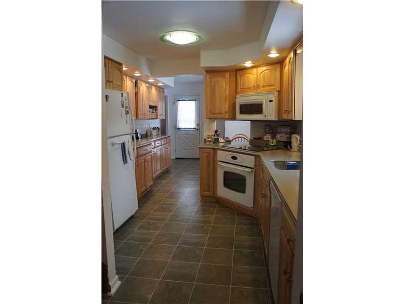510 Upper Cherry Run Road Rural Valley, PA 16249 - Photo 15 of 25 Kitchen. The bright and spacious kitchen is fully updated with an under mounted sink, corian counters, under cabinet and recessed lighting and beautiful wood cabinets!