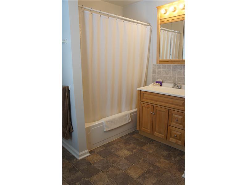 510 Upper Cherry Run Road Rural Valley, PA 16249 - Photo 19 of 25 Full Bath. The main level of the home has this very spacious and updated full bathroom that has a walk in closet and the main level also has a half bathroom/powder room for guests!