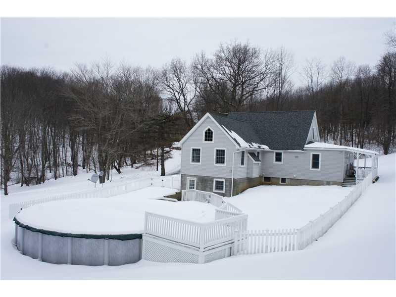 510 Upper Cherry Run Road Rural Valley, PA 16249 - Photo 3 of 25 Exterior Back. There is a 30 Round 5 Deep pool that is completely fenced in along with the side yard. All pool equipment is included. There is a large dog door off the kitchen that has access to the fenced in area!
