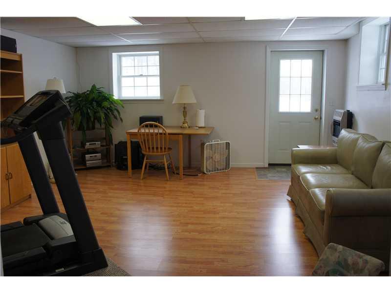 510 Upper Cherry Run Road Rural Valley, PA 16249 - Photo 25 of 25 Den/Family/Great Room. Another view of the den/game room/office showing the full windows and the door to the outside. This room is mostly above ground and has bright, full windows!