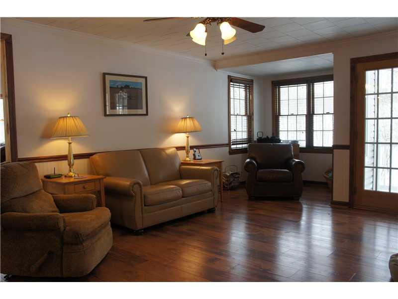 510 Upper Cherry Run Road Rural Valley, PA 16249 - Photo 8 of 25 Living Room. The entry leads into the bright and spacious Living Room with chair rail and a desk/office/reading "nook". This central room in the house leads into the family room, dining room and kitchen!