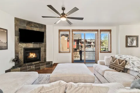a bedroom with a large bed and a fireplace
