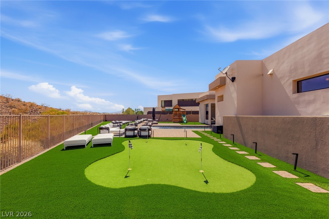 5 Crystal Tree Pass Henderson, NV 89052 - Photo 44 of 67 Enjoy outdoor leisure with a private putting green, pool, and abundant lounge space.