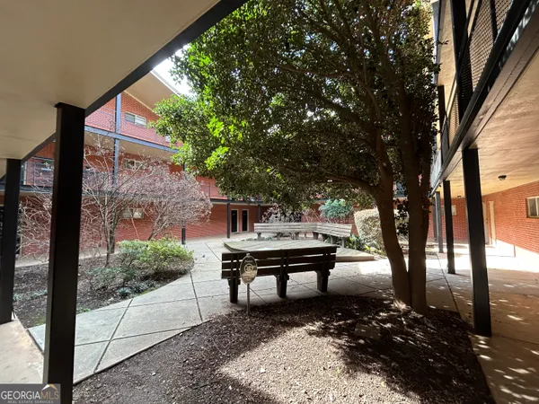 a bench sitting in front of a building