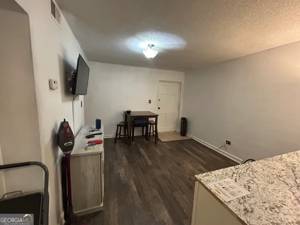 a living room with furniture and flat screen tv