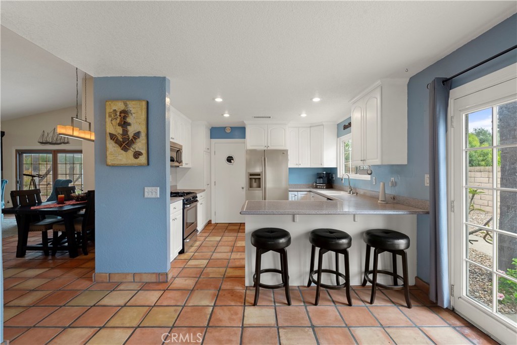 2537 Fulton Road La Verne, CA 91750 - Photo 17 of 43 a kitchen with stainless steel appliances granite countertop a refrigerator and a stove top oven