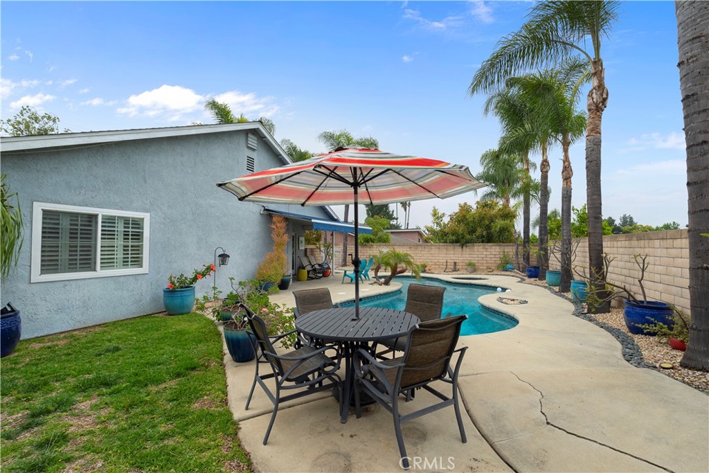 2537 Fulton Road La Verne, CA 91750 - Photo 29 of 43 a view of a patio with chairs and table under an umbrella