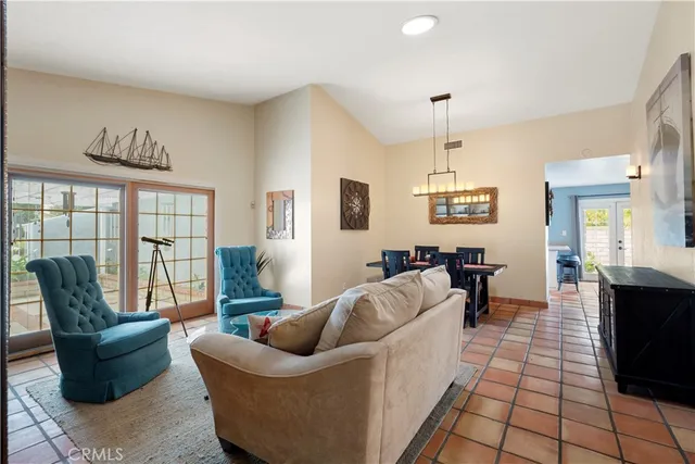 a living room with furniture a rug and a large window
