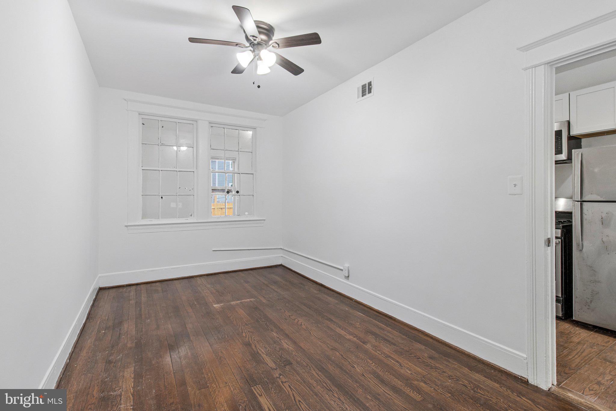 1719 West Virginia Avenue Northeast, Unit 1 Washington, DC 20002 - Photo 18 of 24 a view of empty room with wooden floor and fan