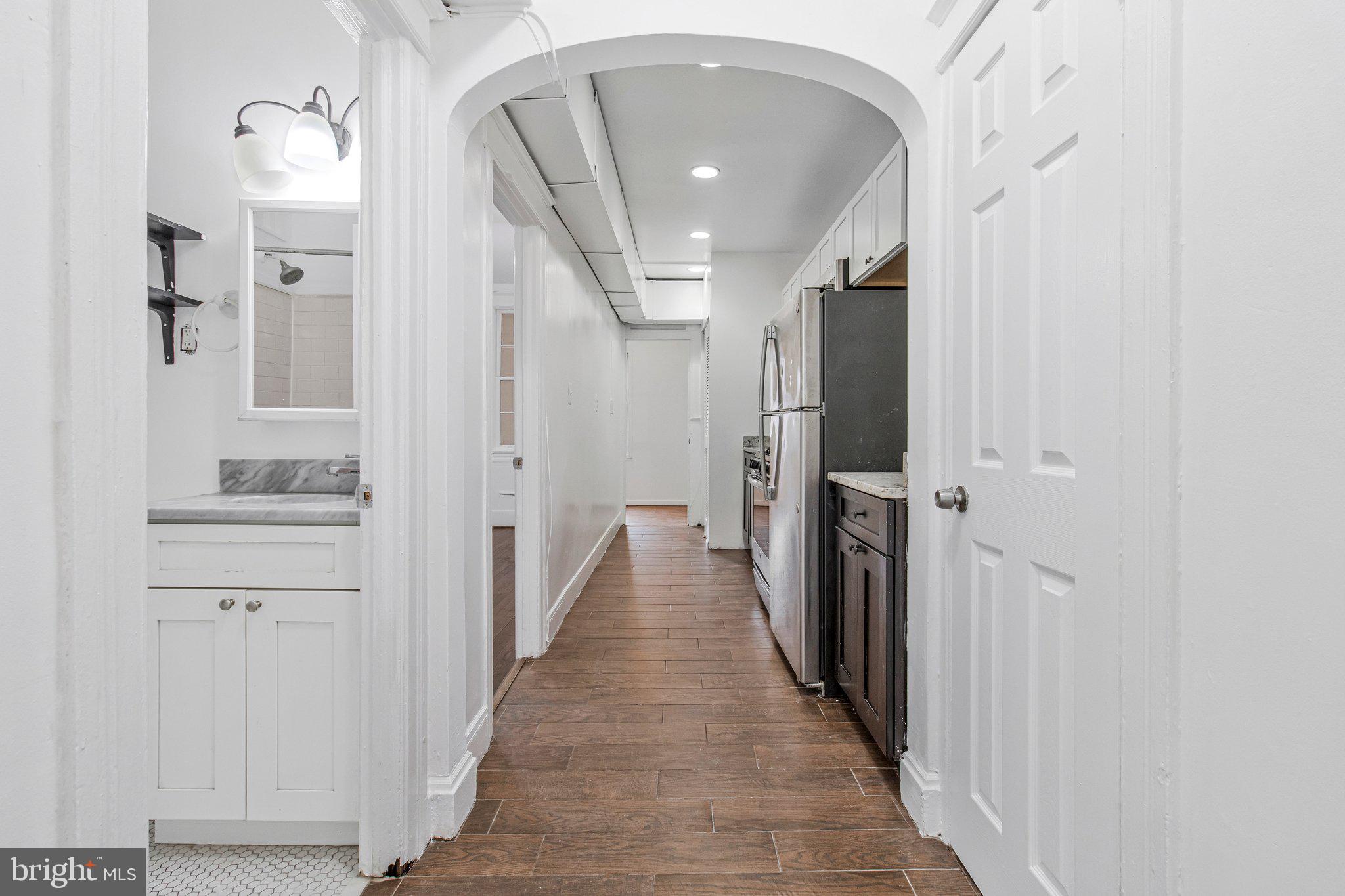 1719 West Virginia Avenue Northeast, Unit 1 Washington, DC 20002 - Photo 9 of 24 a view of a hallway with wooden floor and staircase