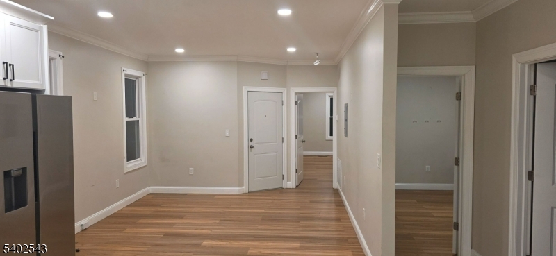 115 Wallington Avenue Wallington, NJ 07057 - Photo 4 of 13 a view of hallway with wooden floor