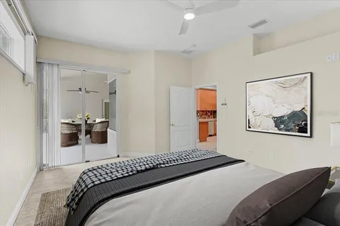 a bedroom with a bed and a view of bathroom